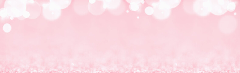 St Valentines day pink background top border wide banner. Love or wedding concept with bokeh lights...