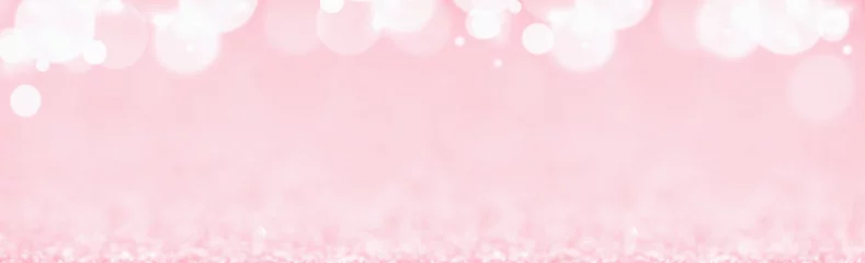 Fotobehang St Valentines day pink background top border wide banner. Love or wedding concept with bokeh lights blurred defocused glitter © taniasv