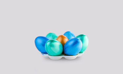 Colorful handmade Easter eggs are collected in a circle, close-up
