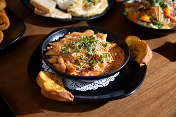 A view of a bowl of penne Arrabbiata.