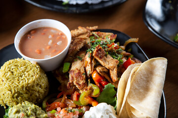 A view of a chicken fajitas plate.