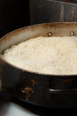A view of a large stockpot full of steamed basmati rice, seen at a local Mediterranean restaurant.