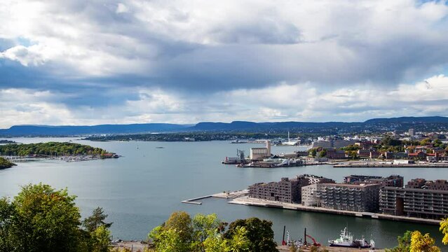 Timelapse of Oslo city bay landscape in daytime fine weather with fast moving clouds