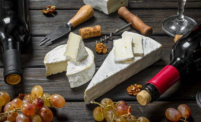 Brie cheese with red wine, nuts and grapes.