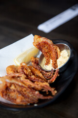 A view of an appetizer plate of deep fried baby octopus.