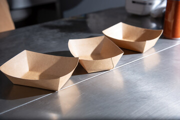 A view some empty food order cardboard or cardstock trays.