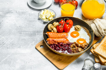 English breakfast. A variety of snacks with orange juice.