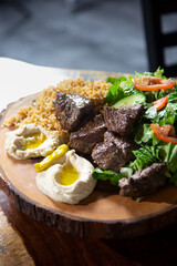 A view of a platter of beef shish kabob.