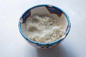 A view of a condiment cup of French sea salt.