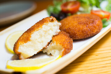 Spanish croquettes tapa. The croquette is a portion of dough made from a dense sauce such as bechamel and a mincemeat of various ingredients.