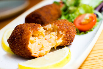 Spanish croquettes tapa. The croquette is a portion of dough made from a dense sauce such as bechamel and a mincemeat of various ingredients.