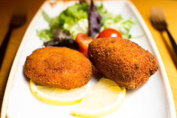 Spanish croquettes tapa. The croquette is a portion of dough made from a dense sauce such as bechamel and a mincemeat of various ingredients.