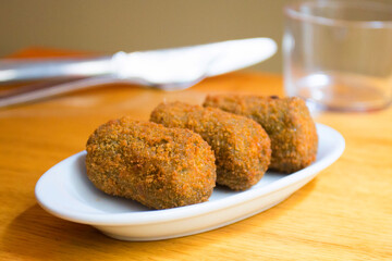 Spanish croquettes tapa. The croquette is a portion of dough made from a dense sauce such as bechamel and a mincemeat of various ingredients.