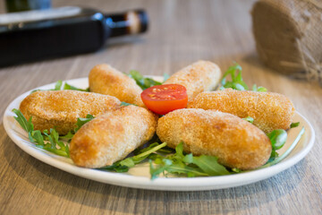 Spanish croquettes tapa. The croquette is a portion of dough made from a dense sauce such as bechamel and a mincemeat of various ingredients.