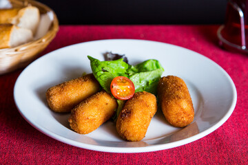Spanish croquettes tapa. The croquette is a portion of dough made from a dense sauce such as bechamel and a mincemeat of various ingredients.