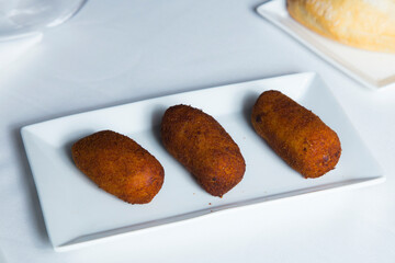 Spanish croquettes tapa. The croquette is a portion of dough made from a dense sauce such as bechamel and a mincemeat of various ingredients.