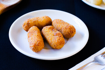 Spanish croquettes tapa. The croquette is a portion of dough made from a dense sauce such as bechamel and a mincemeat of various ingredients.
