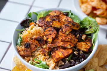 A view of a Mexican style chicken and rice bowl.