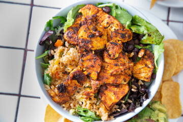 A top down view of a Mexican style chicken and rice bowl.