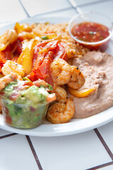 A view of a plate of shrimp fajitas.