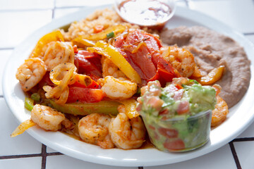 A view of a plate of shrimp fajitas.