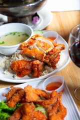 A view of a plate of crispy Hainan chicken.