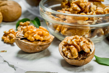 Walnuts in a glass bowl .
