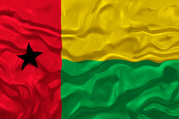 National flag of Guinea-Bissau.  Background  with flag of Guinea-Bissau.