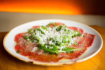Carpaccio is a preparation of raw meat, finely cut or pounded until fine, served mainly as an appetizer. 