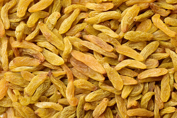 Top view of dry grapes or raisins texture background