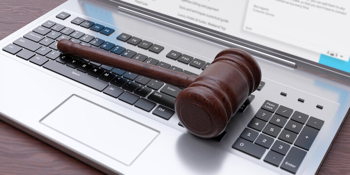 Auction, Cyber law concept. Wooden judge gavel on laptop keyboard background. Above view. 3d render