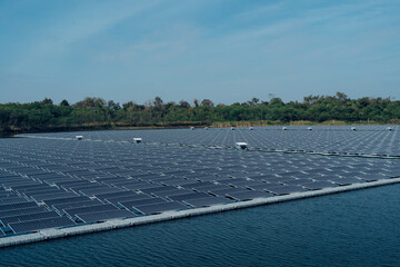 Rows array of polycrystalline silicon solar cells or photovoltaics in solar power plant floating on...