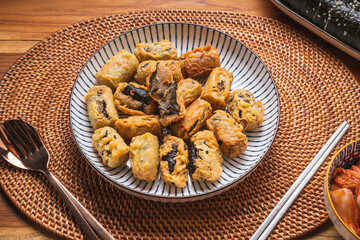 Crispy seaweed noodle rolls or Gimmari Korean deep-fried seaweed rolls, Korean traditional snack food.