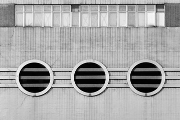 air vent and window on exterior of factory