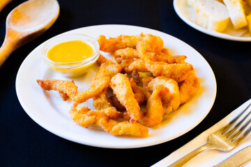 Chicken fingers. Chicken strips or chicken drumsticks are a style of fried chicken that includes only chicken, without bones or skin
