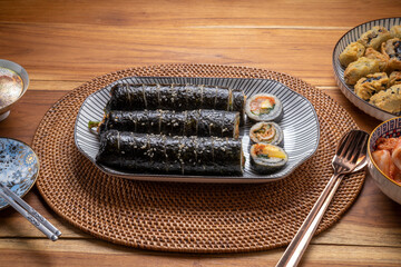 Korean Seaweed Rice Rolls or Kimbap Korean dish made from cooked rice  vegetables, meats that are rolled in seaweed, Bulgogi Kimbap and pork bbq Kimbap Korean food.