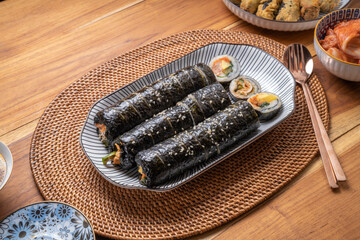 Korean Seaweed Rice Rolls or Kimbap Korean dish made from cooked rice  vegetables, meats that are rolled in seaweed, Bulgogi Kimbap and pork bbq Kimbap Korean food.