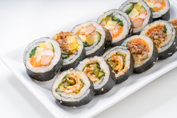 Korean Seaweed Rice Rolls or Kimbap Korean dish made from cooked rice  vegetables, meats that are rolled in seaweed, Bulgogi Kimbap and pork bbq Kimbap Korean food.