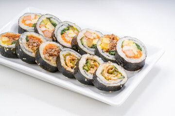 Korean Seaweed Rice Rolls or Kimbap Korean dish made from cooked rice  vegetables, meats that are rolled in seaweed, Bulgogi Kimbap and pork bbq Kimbap Korean food.
