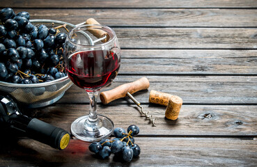 Wine background. Red wine in glasses with grapes.