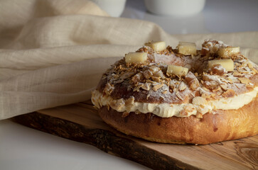 Roscon, Spanish sweet bread-based ring-shaped dessert, on white table