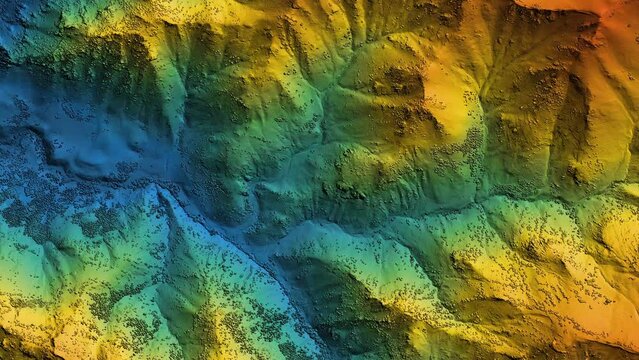 Elevation model animation. GIS product made after proccesing aerial data taken from a drone. It shows high rocky and steep mountain peaks. At their feet are visible valleys and mountain lakes