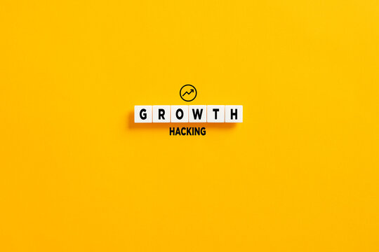 White letter blocks on yellow background with the word growth hacking. Growth hacking in marketing and business