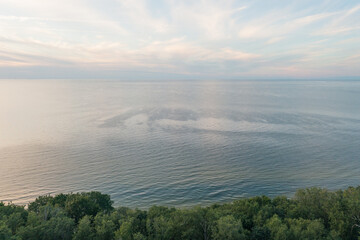 Top view of Narva Bay on a summer evening. Toila Oru Park. The sky is a pastel color. The rich greenery of the park. Space for text. Natural background.