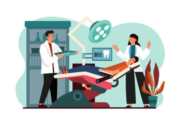 Male dentist and nurse examining patient's teeth at the clinic.