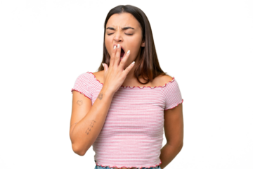Young caucasian woman isolated on green chroma background yawning and covering wide open mouth with hand