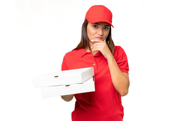 Pizza delivery caucasian woman with work uniform picking up pizza boxes isolated on green chroma...