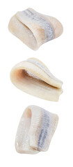 Herring, fillet folded in half, bent, three pieces, falling, hanging, flying, soaring isolated on white background with clipping path, side view