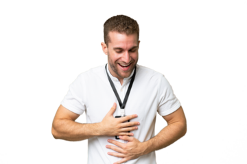 Young caucasian man with ID card isolated on green chroma background smiling a lot