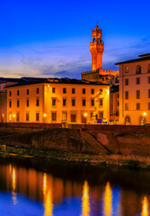Fototapeta na wymiar Famous Palazzo Vecchio Palace and the river Arno at sunset, Florence, Italy